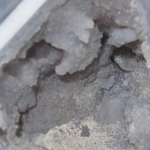 Load image into Gallery viewer, Close-up of a mineral sample with a rough texture