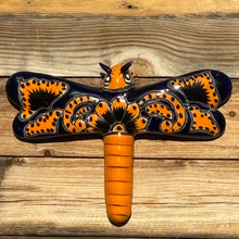 Load image into Gallery viewer, Decorative wall art with a dragonfly design on a wooden surface