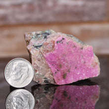 Load image into Gallery viewer, Cobaltoan Dolomite Bright Pink Mineral with dime for size comparison
