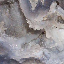 Load image into Gallery viewer, Close-up of a Blue Dugway Geode Half 2 Section Chamber with a focus on texture and color variation.
