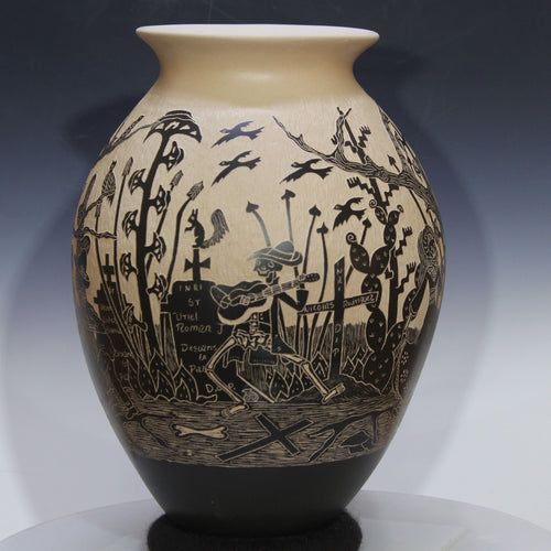 Decorative vase with black silhouette designs on a beige background