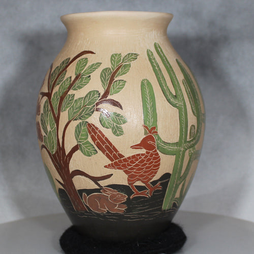 Decorative vase with nature-themed design on a gray background