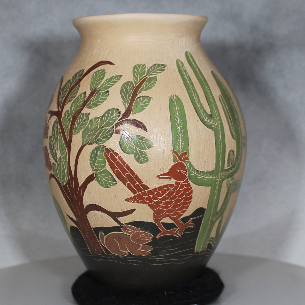 Decorative vase with nature-themed design on a gray background