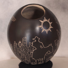 Load image into Gallery viewer, Black ceramic vase with white line drawings of a cowboy, cactus, and sun on a gray background
