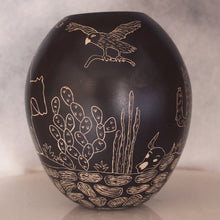 Load image into Gallery viewer, Black ceramic vase with white line drawings of a bird, cactus, and other elements on a black background
