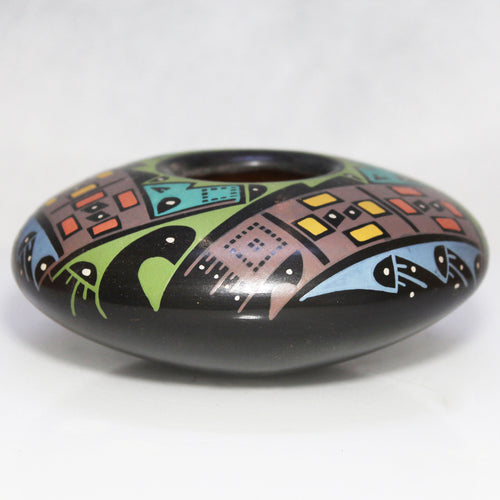 Decorative ceramic bowl with colorful abstract patterns on a white background