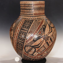 Load image into Gallery viewer, Decorative vase with intricate patterns on a dark background
