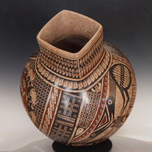 Load image into Gallery viewer, Decorative ceramic vase with intricate patterns on a gradient background
