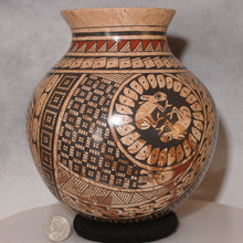 Load image into Gallery viewer, Mata Ortiz Pottery Swirling Clay with quarter for size comparison

