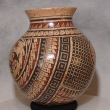 Load image into Gallery viewer, Ceramic vase with intricate geometric patterns on a gray background
