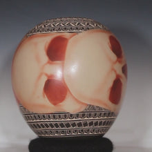 Load and play video in Gallery viewer, Video of mata ortiz pottery with airbrushed red skulls
