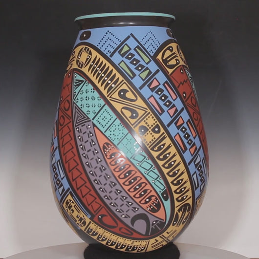 Video of Oscar Quezada masterpiece pottery with bright bold colors