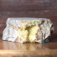 Load image into Gallery viewer, Septarian Geode Section - Triangle Mass of Molten Yellow Crystals
